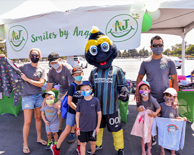 Family-Kinecta-Mascot-and-Backpacks.jpg