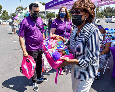 Maxine-Waters-Passing-Out-Backpacks-(2).jpg Maxine-Waters-Passing-Out-Backpacks-(2).jpg