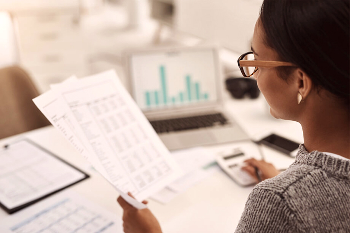 Woman looking over documents