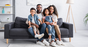 family sitting on a couch