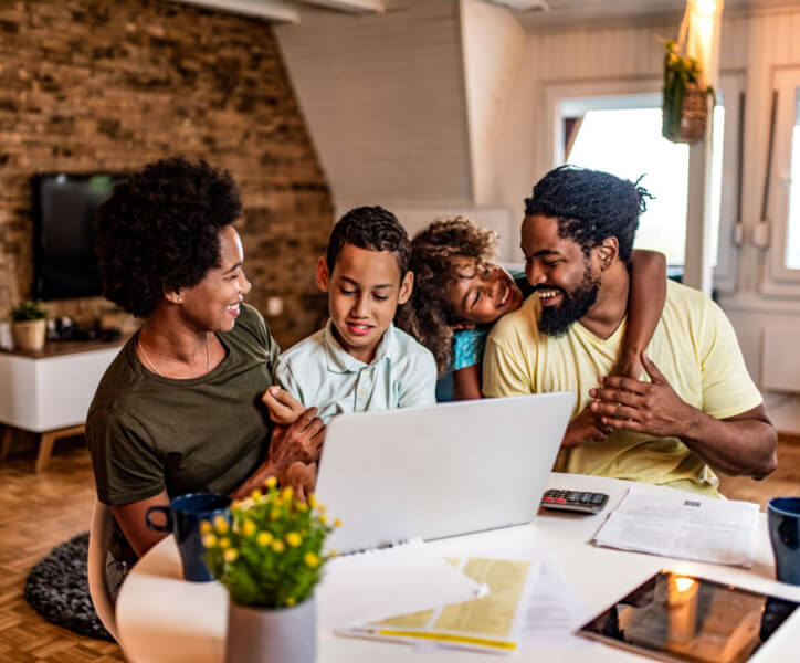 Family in front of a computer